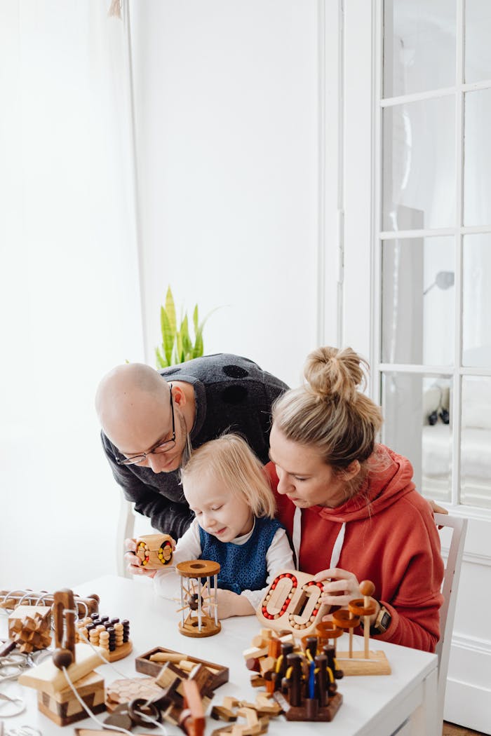 Family enjoying time together solving wooden puzzles at home.